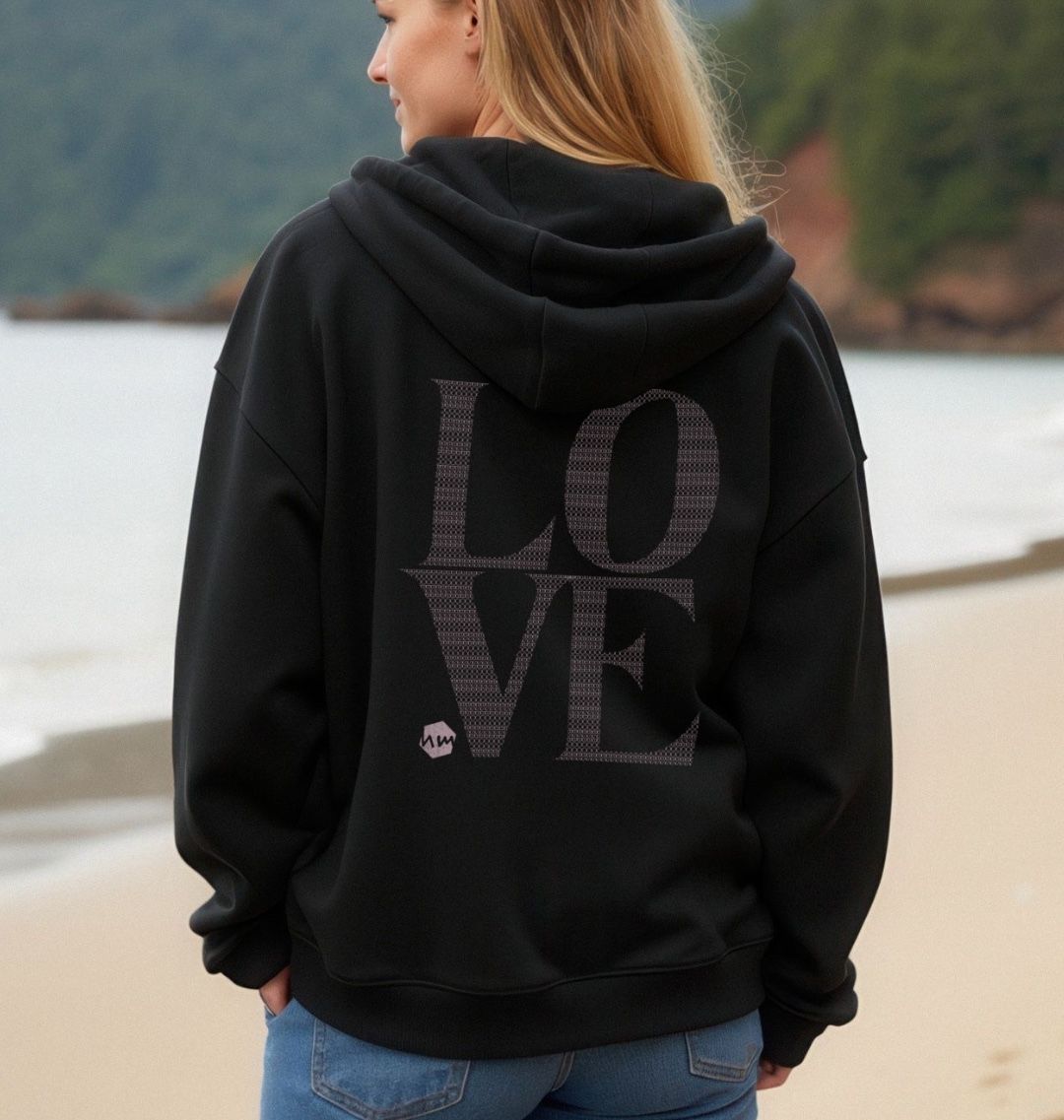 The back of a black zip hoodie with the word LOVE written on it