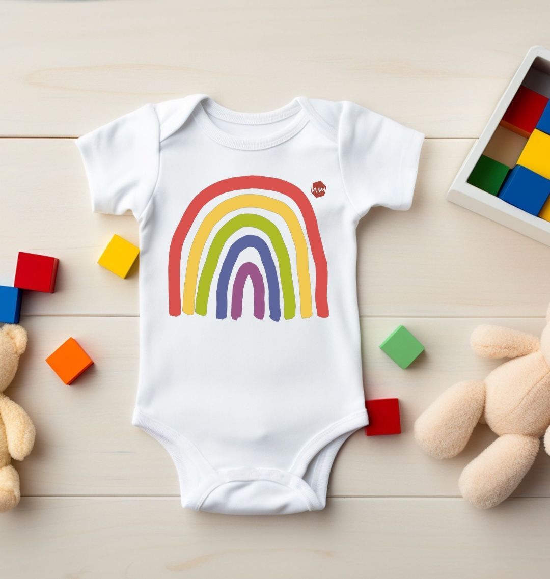 A white Human Milk baby and toddler bodysuit with a print of a rainbow on the front
