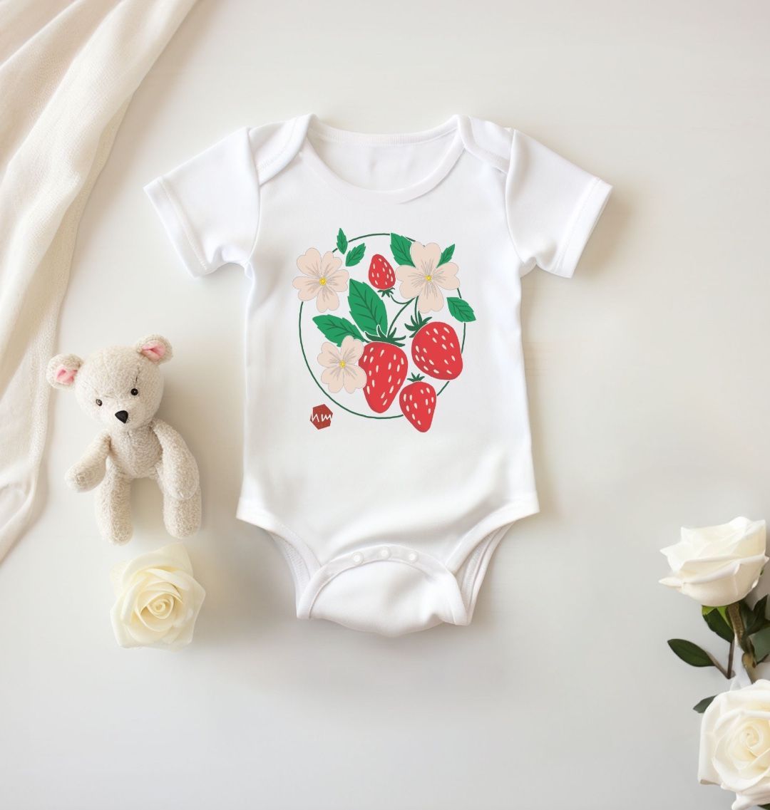 A white baby and toddler bodysuit with a print of strawberries on the front
