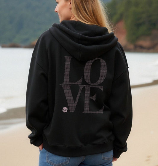 The back of a black zip hoodie with the word LOVE written on it